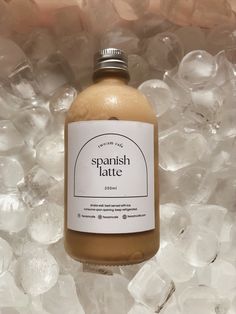 a bottle of spanish latte sitting on top of ice