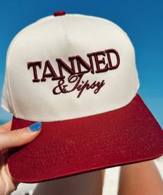 Cutest vintage trucker hat that reads Tanned & Tipsy. A must for summer days! One size Adjustable back Made in USA Summer Trucker Hat With 5-panel Design, Summer Trucker Hat 5-panel Style, Summer Trucker Hat In 5-panel Style, Summer Trucker Hat 5-panel, Summer Snapback Hat With Curved Brim And Letter Print, Summer Snapback Hat With Letter Print And Curved Brim, Summer Snapback Hat With Letter Print, Brown Summer Trucker Hat With Curved Bill, Summer Trucker Hat With Letter Print And Flat Brim