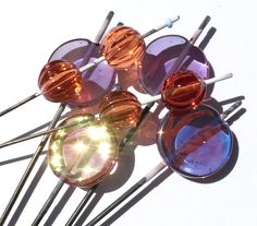 several different colored glasses sitting on top of each other