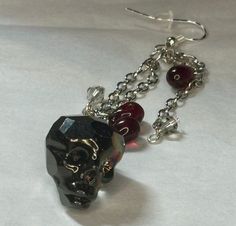 These spooky skull earrings add a gothic touch to any outfit.  Whether accessoring for daily outfits or channeling your Halloween spirit, these earrings will be sure to stand out Alternative Style Halloween Gift Earrings, Gothic Skull Earrings For Party, Handmade Gothic Drop Earrings, Gothic Dangle Halloween Jewelry, Gothic Skull Earrings For Halloween, Gothic Skull Metal Earrings, Spooky Dangle Earrings, Upper Darby, Halloween Unique