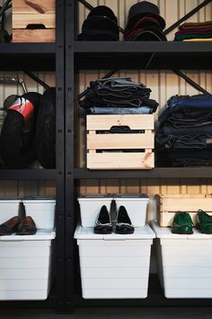 the shelves are filled with shoes and other items in bins next to each other