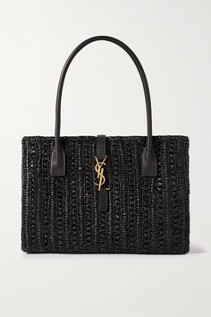 SAINT LAURENT's 'Panier' tote will look equally chic in the city as it will on the beach. Woven from black raffia, it's topped with slim leather handles and has the label's signature 'YSL' plaque in gold-tone hardware. Village Market, Raffia Tote Bag, Monogram Tote, Medium Tote, Saint Laurent Bag, Black Tote, Beach Tote Bags, Leather Handles, Quilted Leather