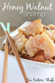 a white bowl filled with food and chopsticks next to the words honey walnut shrimp