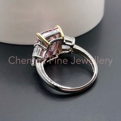 "This Morden LAVISH designer Pink Topaz ring is made with emerald cut pink Topaz with clear topaz side gemstones. The perfect Christmas gift for wife or for Mum. 💎 Main Gemstone: Pink Topaz 10*14mm 💎 Main Gemstone Shape: baguette 💎 Side Gemstones: Clear Topaz 💎 Material: Sterling Silver with rhodium finish. 💎 Band Size - please message us with your correct ring size. If you require any size that is not listed please send me a message. 『 Other Precious metal bands are available in 9k / 14k / Modern Emerald Cut Topaz Ring For Wedding, Modern Pink Diamond Rings, Pink Diamond Topaz Ring For Anniversary, Pink Diamond Topaz Ring For Wedding, Emerald Cut Rings With Side Stones For Gift, Pink Emerald Ring For Wedding, Pink Topaz Wedding Ring With Diamonds, Pink Emerald-cut Sapphire Wedding Ring, Wedding Pink Topaz Ring With Diamond