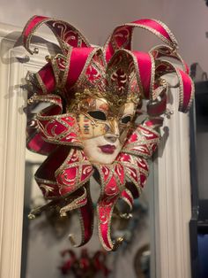 Beautiful Original Venetian jester mask made of paper mache (papier mâché) . The face of the Jester mask is decorated with playing cards, antique crackling and a gold trim. The Pointed headpiece is made of red velvet and it has golden bells. This is a piece of art for your wall. also it can be used for carnival, bal masque, costumed ball and theme parties. exclusive wall decoration . This mask is also a beautiful christmas decoration for your house and a unique holiday gift. Venetian Masks For Carnival Themed Events, Venetian Masks And Prosthetics For Carnival, Venetian Masks And Prosthetics For Mardi Gras, Venetian Masks For Themed Carnival Events, Artistic Red Masks And Prosthetics For Festivals, Red Masquerade Mask For Mardi Gras, Artistic Masks For Carnival Themed Events, Artistic Red Masks For Costume Party, Artistic Red Mask For Costume Party