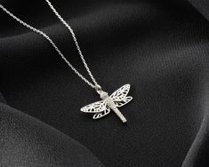 Dragonfly Elegant Necklace - Immortal Love Necklace - Dragonfly Lucky Necklace - Dragonfly Jewelry - Dainty Dragonfly Charm - Loyalty Necklace - Material: Stelling Silver 925. - Finish: Silver, Gold Plated, Rose Gold Plated. - Personalization: Personalize this necklace with a material (Silver, Gold, Rose Gold). Step into a world of enchantment with our Dragonfly Elegant Necklace. This captivating piece of jewelry beautifully captures the delicate grace and mesmerizing beauty of the dragonfly, a symbol of transformation, adaptability, and the magic of the natural world. Meticulously crafted with attention to detail, the necklace features a stunning dragonfly pendant, its wings outstretched in flight. The dragonfly represents the ability to navigate through life's changes with grace and eleg Elegant Adjustable Dragonfly Necklace, Lucky Necklace, Dragonfly Jewelry, Mesmerizing Beauty, Dragonfly Charm, Dragonfly Pendant, Jewelry Dainty, Elegant Necklace, Elegant Necklaces