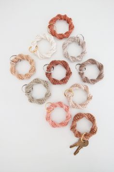 six pairs of crochet bracelets with keys