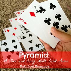 a hand holding playing cards with the words pyramid