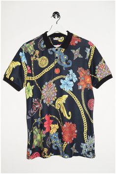 Add some bling to your wardrobe with our Versace Polo Shirt! Straight from Italy, this Gianni Versace T-shirt rocks funky colors, floral and chain patterns, and the iconic Medusa. Perfect for making a bold statement, this isn't just a shirt--it's a vibe. Grab yours and strut like you own the runway! - Size tag:  Men's Large. - Measurements (laying flat): Please always check measurements before buying. Pit to Pit: 21" Length: 28.5" -Wear: /Please see images for details/ Good used condition,slightly color faded on the collar with light fabric moss. -Flaws: / serious wear, tears, holes, marks or stains/  None *All of our items are preloved pieces so some signs of natural wear and age are to be expected. Please look through the photos carefully to check if the condition is to your satisfaction Designer Multicolor Graphic Print Tops, Designer Multicolor Printed Tops, Designer Multicolor Print Summer Tops, Designer Multicolor Print Tops For Summer, Designer Graphic Print T-shirt For Spring, Versace Polo Shirt, Versace Polo, Funky Colors, Versace T Shirt