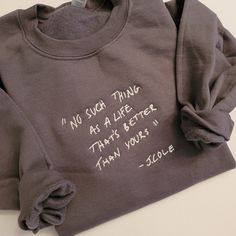 "This classic trendy unisex embroidered sweatshirt is perfect for your wardrobe. Featuring a quote from J.Cole, \"No such thing as a life that's better than yours,\" this sweatshirt is sure to become your go-to top. Crafted from a soft poly/cotton blend, this sweatshirt is sure to keep you comfortable and warm on those chilly days. With its embroidered quote, this sweatshirt provides a subtle yet stylish look that is perfect for any occasion. Whether you're relaxing at home or out and about, this sweatshirt will be sure to turn heads. Embroidery is in the centre of the sweater and is about 5x6 inches in size. Sweatshirt features a tear away tag and has a classic fit. Pieces are made from men's Gildan or Jerzees sweatshirts. For the oversized look we suggest sizing up, please refer to size Friend Song Lyrics, Crewneck Aesthetic, Travel Sweater, Friend Song, Birthday Gift For Friend, Business Notes, Clothes Storage Boxes, Better Than Yours, Famous Words