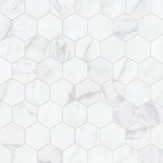 white marble hexagon tiles with light gray veining on the edges and bottom