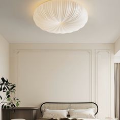 a bedroom with a bed and white walls