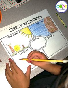 a child's hands holding a pencil over a piece of paper that says stick and stone