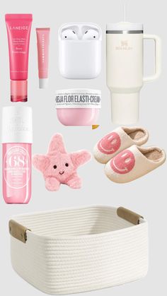 the contents of a white basket with pink accessories