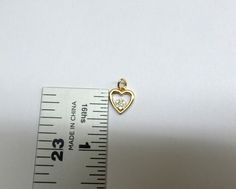 Diamond Heart Necklace / 14k Gold Diamond Heart Necklace / Solid Gold Heart Necklace / Dainty Heart Necklace / 14k Gold Diamond Heart Pendant / BRIDAL JEWELRY / BIRTHDAY GIFT / VALENTINE'S GIFT / ANNIVERSARY GIFT / GIFT FOR HER / HEART NECKLACE / LOVE NECKLACE FREE SHIPPING WITHIN THE USA HANDMADE BEAUTIFUL 14K SOLID YELLOW GOLD DIAMOND HEART NECKLACE. TOTAL OF 7 ROUND BRILLIANT CUT NATURAL EARTH MINED DIAMONDS TCW 0.14CT. THE DIAMONDS ARE ALL NATURAL SI1 CLARITY G COLOR. I MAKE THIS NECKLACE AL Gold Heart Necklace With Hallmark, Anniversary Heart Cut Necklace With Charms, Anniversary Heart Cut Charms Necklace, Yellow Gold Heart Necklace With Charms For Anniversary, Anniversary Yellow Gold Heart Necklace With Charms, Anniversary Heart Necklace With Double Heart Charms, Gold Diamond Heart Necklace, Dainty Heart Necklace, Diamond Heart Necklace