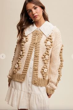 Crochet, flower detailed cardigan. Elegant Knitted Sweater Coat For Spring, Elegant Spring Knitted Sweater Coat, Hand Knitted Cream Cardigan For Spring, Crochet Cream Cardigan For Fall, Beige Knitted Sweater Coat For Spring, Spring Cream Knitted Outerwear, Spring Cream Chunky Knit Sweater Coat, Chic Knitted Sweater Coat For Spring, Chic Fall Sweater With Crochet Trim