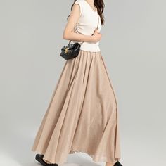 This exquisite linen skirt is the epitome of effortless elegance, presented in a neutral beige that exudes a serene charm. The skirt features a comfortable, elastic waistband that ensures a snug fit while providing ease of movement.  More colors: https://etsy.me/3IHN6CL DETAIL * 75% linen, 25% cotton * Cotton liner * Elastic waistband * Without pockets * pleated elastic waist detail * Plus size skirt * Circle skirt * Perfect summer spring skirt * Dry clean * The model is 170cm (5′7″) tall with a Long Skirt Pleated, Flowy Long Skirt, Maxi Linen Skirt, Custom Skirt, Skirt Circle, Spring Skirt, Skirt Flowy, Long Flowy Skirt, Skirts Flowy