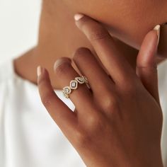 a close up of a person wearing a ring