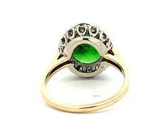 Item Specifications:Metal: 18K Yellow Gold and 14K White Gold Style: Statement RingRing Size: 5.5 (resizing available for a fee)Total Weight: 3.5 GramsGemstone Specifications:Center Gemstone: Jadeite JadeShape: Oval Color: GreenCut: Cabochon Jade Measurements: 11.52 mm x 8 mm x 2.62 mmJade Carat Weight: ~2.18 caratsDiamond Count: 14 round brilliant Diamond Weight: ~0.40 caratsDiamond Color: G-HDiamond Clarity: VS2-SI2Condition: Vintage, ExcellentStamped: "14k" "18k" Green Victorian Diamond Ring, Victorian Style Green Diamond Ring, Antique Multi-stone Round Emerald Ring, Antique Round Multi-stone Emerald Ring, Collectible Multi-stone Emerald Ring, Green Diamond Collectible Ring, Collectible Green Diamond Ring, Green Heirloom Halo Ring, Green Hallmarked Cluster Ring