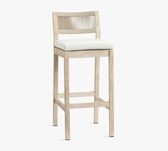 a wooden stool with a white upholstered seat and back rest on a white background