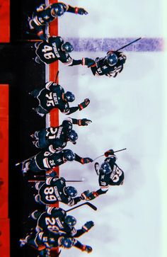 the hockey team is lined up on the ice