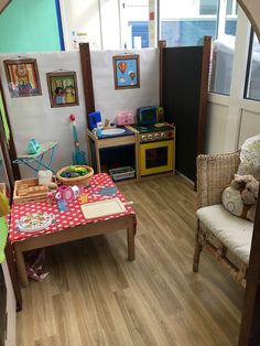 a child's playroom with wooden floors and toys