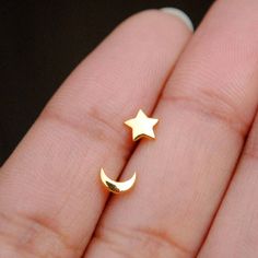 Tiny little stars and moons for everyday delights! Handcrafted in 14K gold, these trinkets can be worn as nose pins as well as ear studs. * Gold - 14K Solid Yellow Gold (star/moon + pushback) * Post length : 8 mm (approx.) * Dimensions (approximate) : 5-6 mm * Style : Pushback ------------- > Star Moon C/L Wire Nose Pins : https://www.etsy.com/in-en/listing/534464641/star-moon-14k-solid-gold-nose-pins-moon?ref=shop_home_active_1 Find us on Instagram for exquisite designs: @abhikajewels Like u Gold Piercings With Star Charm As Gift, Celestial Star Cartilage Earrings As Gift, Celestial Star Piercings Gift, Gold Star Cartilage Earrings Minimalist Style, Gold Star Cartilage Earrings In Minimalist Style, Dainty Gold Star Cartilage Earrings, Celestial Star-shaped Piercings As Gift, Celestial Star-shaped Piercings For Gifts, Tiny Gold Star Cartilage Earrings