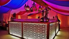 an elaborately decorated bar with chandeliers and lights