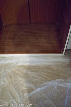 the inside of a closet with plastic covering it