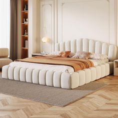 a large bed sitting on top of a wooden floor next to a book shelf filled with books