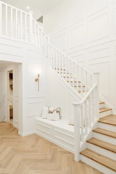 there is a white stair case in the house