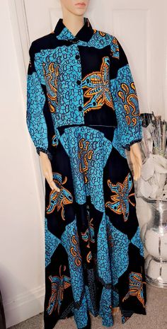 This is a beautiful African print dress with Rhinestones details ,specially made with quality material. It is 100% cotton. Patterned Cotton Dress With Graphic Print, Casual Cotton Dresses With Matching Set, Cotton Graphic Print Patterned Dresses, Summer Long Sleeve Dresses Matching Set, Long Sleeve Matching Set Dresses For Summer, Long Sleeve Summer Dresses Matching Set, Summer Long Sleeve Dresses With Matching Set, Blue Cotton Dress With Graphic Print, Multicolor Long Sleeve Dresses With Vintage Print