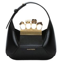 Stijlvol en chic, deze Black Bag van Alexander McQueen is gemaakt om op te vallen! Perfect als aanvulling op je lente- en zomeroutfits, deze schoudertas is gemaakt van diverse materialen en straalt pure elegantie uit. Haar platte, zwarte ontwerp maakt haar dé perfecte aanvulling op iedere outfit. Met een breedte van 20 cm, hoogte van 12 cm, diepte van 4 cm en een riemlengte van 52 cm is deze tas een compacte, maar toch opvallende keuze. Toe aan wat high-end elegantie? Deze tas wacht op jou! Alexander Mcqueen Handbags, Alexander Mcqueen Bag, Leather Mini Bag, Charm Ring, Black Shoulder Bag, Engraved Logo, Mini Shoulder Bag, Black Tote, Crystal Embellishment