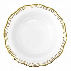 a white and gold plate with lines on it