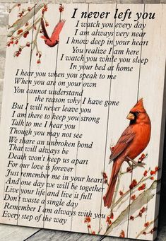 a wooden sign with a cardinal sitting on a branch and the words i never left you