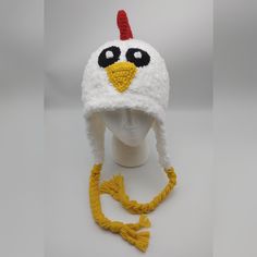 "Perfect for the chicken lover in your life Hat is made to order in any size. It's made with a combination on acrylic white yarn and Berna Pipsqueak yarn, giving it a super soft feel. Buttons are used for the eyes and may vary depending on my stock. Customizations are welcome...different comb, tassels, etc. Please make a \"Note to Seller\" about your preferences Don't forget to add Chicken Feet Covers to complete your Chicken Halloween Costumes https://www.etsy.com/listing/744100147/crochet-chic White Novelty Hat For Halloween, White Novelty Halloween Costume Hats And Headpieces, Funny White Hat As A Gift, White Novelty Halloween Costume Hat, Funny White Hat As Gift, Funny White Hat For Gift, White Halloween Cap, White Playful Adjustable Hat, Playful White Adjustable Hat