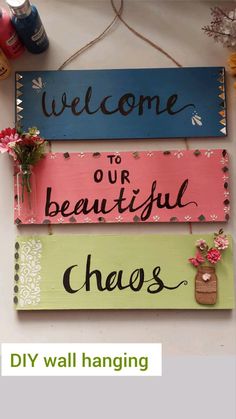 three wooden signs that say welcome to our beautiful cheeses