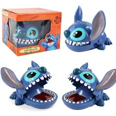 the toy is blue and has teeth on it's head, with an orange box in the background