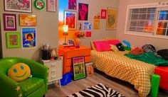 a child's bedroom decorated in bright colors