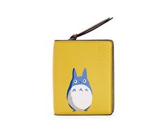 a yellow wallet with a blue and white totoro on it