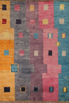 a multicolored rug with squares and rectangles