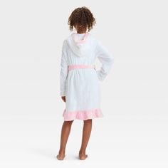 Your kid will be ready to wind down for bed in cozy style with this FAO Schwarz Hooded Robe with Headband. This white robe features a hooded design with a pink belt tie and ruffled hem, and it comes with a matching pink headband with a bow for a cute look. Made from soft knit fabric, this long-sleeve robe will be their new go-to pick for sleeping or lounging around the house. Hooded White Sleepwear For Sleepover, White Hooded Sleepwear For Sleepovers, Cozy White Robe For Winter, White Hooded Sleepwear For Loungewear, Spring White Robe For Bedtime, White Long Sleeve Winter Robe, Cozy White Winter Robe, Cozy White Hooded Sleepwear, White Spring Bedtime Robe