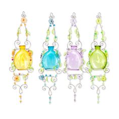 three colorful glass vases hanging from chains on a white wall, each with beaded accents