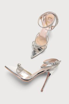 Party season arrived just in time! The Lulus Lullie Silver Vinyl Rhinestone Ankle Strap Pointed-Toe Pumps have a shiny faux leather composition and a clear vinyl pointed-toe upper. Sparkly rhinestones adorn the wrapping adjustable ankle strap and topline and form a dramatic bow detail on the toe box. 4. 5" wrapped stiletto heel. Cushioned insole. Felted rubber sole has nonskid markings. All Man Made Materials. Imported. Lulus | Lullie Silver Vinyl Rhinestone Ankle Strap Pointed-Toe Pumps. Embellished Ankle Strap Patent Leather Heels, Embellished Patent Leather Ankle Strap Heels, Clear Heels With Rhinestones And Ankle Strap, Glamorous Embellished Clear Heels, Glamorous Clear Embellished Heels, Silver Bedazzled Ankle Strap Heels, Party Heels With Rhinestones In Patent Leather, Beautiful Heels, Lulu Fashion