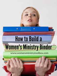 a woman holding stacks of binders with the words how to build a women's ministryry binder