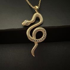 "Gold Snake Necklace, 925k Sterling Silver Tiny Snake Pendant, Minimal Serpent Charm, Hecate's Snake Pendant, Modern Jewelry, Gift for Her Little Snake has a lot to say  🐍 🐍  Snakes represent dual expression of good and evil. Our little snake shows her good side. \"By night one way, by day another  Thus shall be the norm  Till you receive true love's kiss  then, take love's true form.\" Princess Fiona - 3𝟎% 𝐝𝐢𝐬𝐜𝐨𝐮𝐧𝐭 𝐚𝐩𝐩𝐥𝐢𝐞𝐬 𝐰𝐡𝐞𝐧 𝐲𝐨𝐮 𝐩𝐮𝐫𝐜𝐡𝐚𝐬𝐞  2  𝐢𝐭𝐞𝐦𝐬 𝐭𝐨𝐠𝐞𝐭𝐡𝐞𝐫 - Item Details, ✔️ Made of certified 925k sterling silver ✔️ 14k Gold Plated ✔️ Height of the pendant is 2.8 cm (1.1 inches) ✔️ 45 cm silver chain is included in price ✔️ Zircon stones were used on the pendant ✔️ Free, Express, and Insured Shipping ✔️ Unique minimalist design You can chec Luxury Snake-shaped Necklace For Formal Occasions, Cheap Snake Shape Necklace For Gift, Gift Jewelry With Curb And Snake Chain, Snake Shape Clavicle Chain Jewelry As A Gift, Gold Snake-shaped Engraved Necklace, Gold Snake Necklace With Engraving, Gold Engraved Snake Necklace, Snake-shaped Engraved Jewelry Gift, Engraved Snake-shaped Jewelry Gift