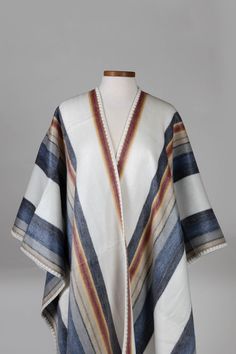 A striking layer over jeans and tall boots. Wrap up and keep warm in this reversible poncho. Handmade by makers with our artisan partner, Camari, working with makers to ensure they receive stable, fair income that enables them to carry on family traditions of working the land and preserving indigenous culture through traditional crafts. Alpaca Shawl, Chain Scarf, Partner Work, Candle Wall Decor, Hooded Poncho, Indigenous Culture, Chevron Stripe, Quito, Accessories Bags Purses