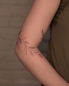 a woman with a tattoo on her arm