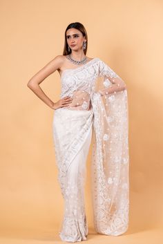 Experience the epitome of luxury with our White Designer Net Saree, embellished with detailed embroidery. This saree radiates elegance and sophistication, making it the ideal choice for any special event. Stand out as a masterpiece of style and grace with this unique piece. White Fitted Pre-draped Saree With Chikankari Embroidery, White Organza Pre-draped Saree For Eid, Tissue Silk Pre-draped Saree With Chikankari Embroidery, Fitted Organza Pre-draped Saree With Chikankari Embroidery, Fitted Pre-draped Saree With Chikankari Embroidery For Reception, White Embroidered Organza Pre-draped Saree, White Unstitched Organza Pre-draped Saree, Semi-stitched Chikankari Pre-draped Saree For Reception, Embroidered White Tissue Silk Pre-draped Saree