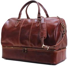 Venezia Drop Bottom Leather Duffle Bag – Floto Classic Cognac Weekender Bag With Leather Lining, Classic Brown Travel Bag For Weekend Trips, Classic Cognac Weekender Bag With Leather Handles, Leather Cognac Weekender Bag For Overnight Trips, Leather Weekender Bag In Cognac For Overnight Trips, Classic Leather Duffle Bag For Weekend Trips, Classic Cognac Duffle Bag With Leather Handles, Classic Travel Bag With Leather Lining For Overnight Trips, Classic Brown Weekender Bag For Weekend Trips